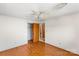 This bedroom features hardwood floors, a ceiling fan, and neutral paint at 3320 28Th Ne St, Hickory, NC 28601