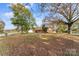 Landscaped front yard featuring a classic brick home with mature trees at 3320 28Th Ne St, Hickory, NC 28601