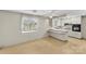 Bright eat-in kitchen with breakfast bar and views to the backyard, features all-white cabinets and appliances at 3320 28Th Ne St, Hickory, NC 28601