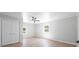 Freshly painted bedroom with a modern ceiling fan and ample natural light from the large windows at 3715 Dallas High Shoals Hwy, Dallas, NC 28034
