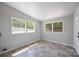 Bright room with ample natural light from large windows and neutral tones; flooring is a mix of ceramic and linoleum tile at 3715 Dallas High Shoals Hwy, Dallas, NC 28034