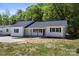 Charming single-story home features a classic white exterior and black shutters at 3715 Dallas High Shoals Hwy, Dallas, NC 28034