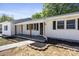 Inviting front porch with wooden beams and a freshly landscaped garden at 3715 Dallas High Shoals Hwy, Dallas, NC 28034