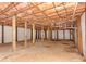 Unfinished basement with exposed beams and concrete floor at 4303 Greenhaven Ln, Gastonia, NC 28056