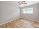 Bedroom with laminate flooring, natural light, and neutral paint at 4303 Greenhaven Ln, Gastonia, NC 28056