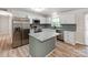 Updated kitchen featuring white cabinets, granite countertops, and stainless steel appliances at 4303 Greenhaven Ln, Gastonia, NC 28056
