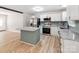 Bright and airy kitchen featuring an island, stainless appliances, and granite countertops at 4303 Greenhaven Ln, Gastonia, NC 28056