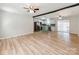 Open-concept living area flowing into a modern kitchen with stainless steel appliances at 4303 Greenhaven Ln, Gastonia, NC 28056