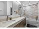 Elegant bathroom with double vanity, marble countertops, modern fixtures, and stylishly tiled shower at 438 Wonderwood Dr, Charlotte, NC 28211