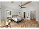 Spacious bedroom with vaulted ceiling, neutral tones, modern ceiling fan, and ample natural light at 438 Wonderwood Dr, Charlotte, NC 28211