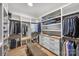Organized walk-in closet with custom shelving, drawers, and ample storage space at 438 Wonderwood Dr, Charlotte, NC 28211
