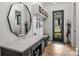 Stylish mudroom with built-in storage, hooks, and a convenient desk area at 438 Wonderwood Dr, Charlotte, NC 28211