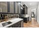 Modern wet bar featuring custom cabinets, a sink, a wine refrigerator, and designer finishes at 438 Wonderwood Dr, Charlotte, NC 28211