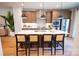 Bright eat-in kitchen featuring a large island with barstool seating and pendant lighting at 451 Old Town Village Rd, Waxhaw, NC 28173