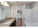 Bathroom with granite countertop vanity, tile flooring, and tub/shower combo at 556 Westwood Dr, Kannapolis, NC 28081