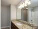 Bathroom featuring granite countertop vanity, a large mirror, and tub/shower combo at 556 Westwood Dr, Kannapolis, NC 28081