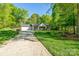 Single-story home with a two-car garage and lush green front yard at 556 Westwood Dr, Kannapolis, NC 28081