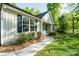 Charming single-story home featuring fresh landscaping and a sidewalk at 556 Westwood Dr, Kannapolis, NC 28081