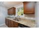 Gorgeous kitchen with granite counters, stainless steel appliances, wood cabinets, and a modern faucet at 556 Westwood Dr, Kannapolis, NC 28081