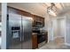A modern kitchen offers stainless steel appliances, granite counters, and ample storage in this stunning home at 556 Westwood Dr, Kannapolis, NC 28081