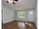 Inviting living room featuring wood floors, neutral walls, large window, and updated lighting at 556 Westwood Dr, Kannapolis, NC 28081