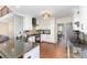 Updated kitchen with granite countertops, white cabinets, and stainless steel appliances at 585 Highland Ridge Rd, Mooresville, NC 28115