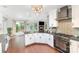 Bright kitchen with modern appliances, granite countertops and views to another room at 585 Highland Ridge Rd, Mooresville, NC 28115