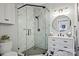 Modern bathroom features white marble tile in glass shower, updated vanity with sink, lighting and decor at 5888 Wood Duck Way, Catawba, NC 28609