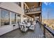 Spacious covered deck with outdoor seating, a fan, and scenic views of the lake and lush landscape at 5888 Wood Duck Way, Catawba, NC 28609