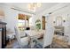 Cozy dining area featuring neutral tones, elegant lighting, and views of the outdoors at 5888 Wood Duck Way, Catawba, NC 28609