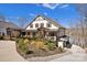 Exterior of a charming two-story home with a landscaped yard and a water view in the background at 5888 Wood Duck Way, Catawba, NC 28609
