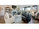 Open-concept living room with a fireplace, large windows, comfortable seating, and scenic views at 5888 Wood Duck Way, Catawba, NC 28609