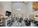 Bright living room with high ceilings, a fireplace, ample seating, and scenic water views at 5888 Wood Duck Way, Catawba, NC 28609