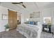 Calm main bedroom with a sliding barn door, natural light, and stylish decor at 5888 Wood Duck Way, Catawba, NC 28609