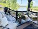 Outdoor seating area with comfortable chairs, a table, grill, plants and a beautiful water view at 5888 Wood Duck Way, Catawba, NC 28609