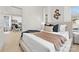 Bedroom with large windows featuring a view and a glimpse into an adjacent room with modern decor at 606 S 10Th St, Bessemer City, NC 28016