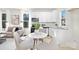 Modern kitchen and dining area with stainless appliances, white cabinets, and hardwood floors at 606 S 10Th St, Bessemer City, NC 28016