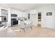 Eat in kitchen features stainless appliances, white cabinets, hardwood floors, and exterior access at 606 S 10Th St, Bessemer City, NC 28016