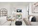 Bright and inviting living room with neutral decor, modern furnishings, and ample natural light at 606 S 10Th St, Bessemer City, NC 28016