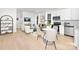 Living, dining and kitchen area. Stainless appliances, white cabinets and hardwood floors at 606 S 10Th St, Bessemer City, NC 28016