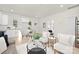Open floor plan with living, dining, and kitchen area bathed in natural light at 606 S 10Th St, Bessemer City, NC 28016