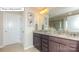 The bathroom features a double vanity with granite countertops and tile floors at 7027 Butternut Oak Ter, Huntersville, NC 28078