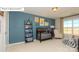 Bedroom with blue accent wall, crib, and window view at 7027 Butternut Oak Ter, Huntersville, NC 28078