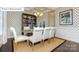Cozy dining room with decorative wallpaper, tray ceilings, and stylish decor at 7027 Butternut Oak Ter, Huntersville, NC 28078