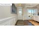Welcoming entryway with detailed trim, hardwood floors, and stylish decor at 7027 Butternut Oak Ter, Huntersville, NC 28078