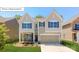 Charming two-story home with a manicured lawn, two-car garage, and attractive curb appeal at 7027 Butternut Oak Ter, Huntersville, NC 28078