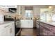 Well-equipped kitchen featuring stainless steel appliances and stylish cabinetry at 7027 Butternut Oak Ter, Huntersville, NC 28078
