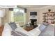 Inviting living room with fireplace, large window, and cozy seating area at 7027 Butternut Oak Ter, Huntersville, NC 28078