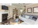 Cozy living room featuring a fireplace and comfortable seating arrangement at 7027 Butternut Oak Ter, Huntersville, NC 28078