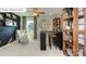 This home office has a ceiling fan, built-in shelves, and ample desk space at 7027 Butternut Oak Ter, Huntersville, NC 28078